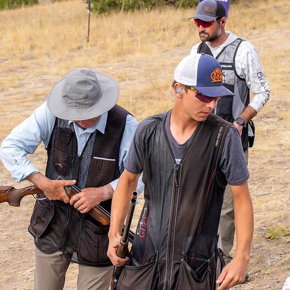 several clay shooters preparing for their shot